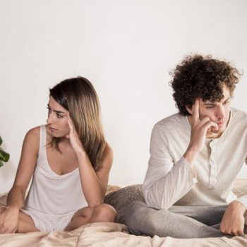 full-shot-upset-couple-bed_23-2148542256