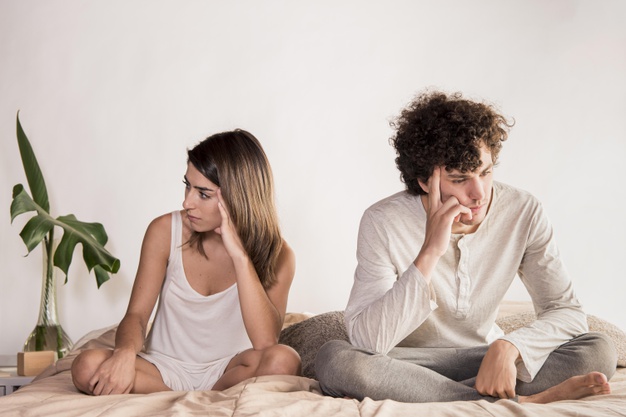 full-shot-upset-couple-bed_23-2148542256