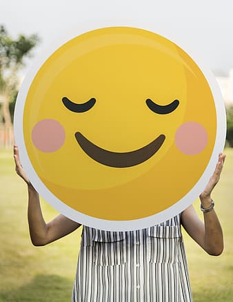 person-holding-yellow-smiley-round-plate-thumbnail